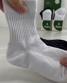 White crew sock on a hand